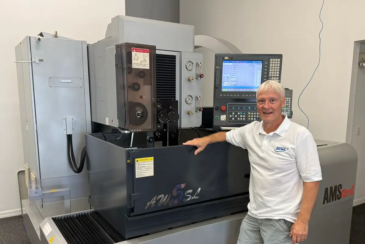 Rich Dubord, EDM Operations, at the machines at Space Coast EDM